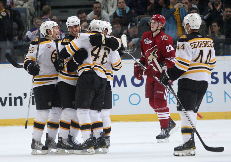 The Bruins celebrate one of their two second-period goals today in Prague, during a 3-0 win over the Phoenix Coyotes. The Bruins split two games and return to the United States for a game Saturday night in New Jersey against the Devils.