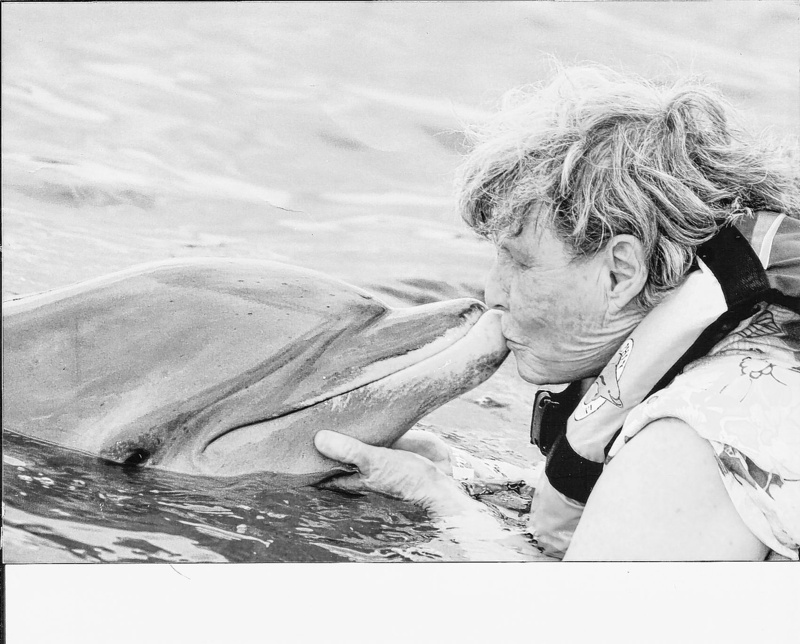 Velma Williams West Clark swims with dolphins while on a Caribbean cruise for her 75th birthday.