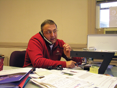 REACHING OUT: Republican gubernatorial candidate Paul LePage speaks during a "Tele-Town Hall" call at his Waterville office on Saturday. LePage was able to reach many people at once with the calls, while answering questions and handling comments.