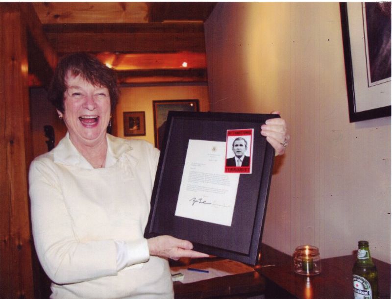 In an undated photo released by the Maine Republican Party on Monday, Democratic gubernatorial candidate Sen. Libby Mitchell is seen smiling and holding a framed document affixed with an image of President George W. Bush that describes him as an "International Terrorist." Mitchell has apologized for the photo's message.