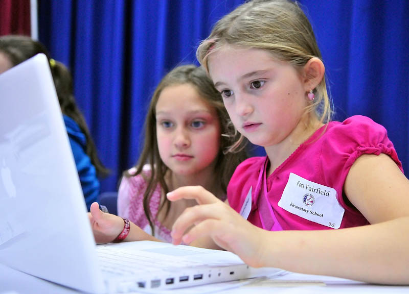 Clarissa Hemphill, left, and Kaley Norsworthy, both students at Fort Fairfield Elementary School, enter results from Maine’s Student Mock Election 2010 into a computer during the “Rally and Tally” event Thursday afternoon at the Augusta Civic Center.