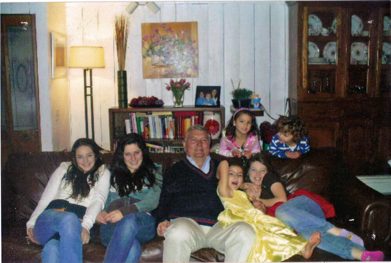Bryant Nicholson hangs out with his six grandchildren last Christmas. From left to right on the couch are Lauren, Shannon, Mia and Megan. Behind them are Ava, left, and David.