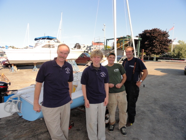 Skipper Steve Price, adult leader from Cape Elizabeth; Thomas Fitts, senior Sea Scout of Scarborough; and South Port Marine's Todd Deslauriers and Mark Ford, both of whom worked hard to make the old boat seaworthy.