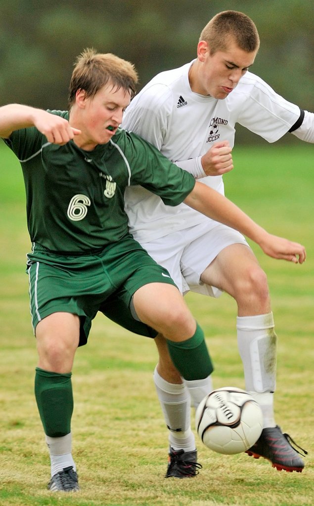 Daniel Wiener of Waynflete, left, contends for the ball with Tom Carter of Richmond during their schoolboy soccer game Thursday. The game ended in a 2-2 tie.