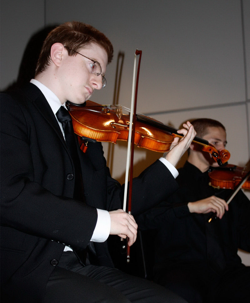 Tyler Clementi, a Rutgers University freshman who leapt to his death from the George Washington Bridge after a cyberbullying incident, plays at a 2009 benefit. He spoke through his violin, his music teacher said.