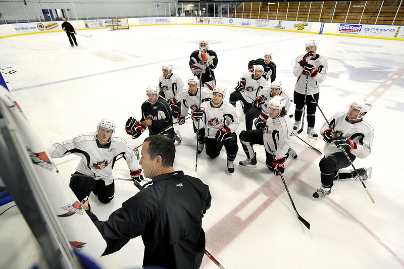 Pirates Coach Kevin Dineen works with a whole lot less than a full group Friday for the team’s first practice at the Portland Ice Arena. The Pirates will have to come together in a hurry – they have one exhibition game Tuesday before the regular season opens Oct. 9.