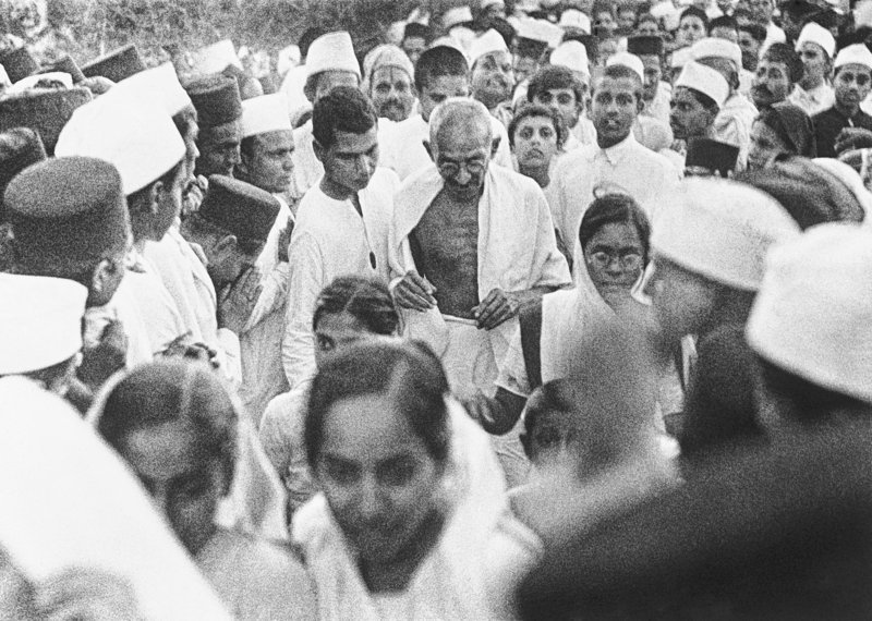 Mahatma Ghandi is surrounded by followers in India during his civil disobedience campaign in March 1930. Gandhi used nonviolent methods to overcome the oppression of Britain and win freedom for the Indian people.