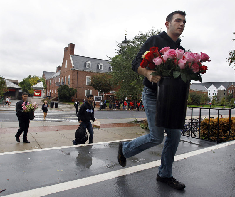Rutgers student Logan Gray heads to a service Friday for Tyler Clementi, who killed himself Sept. 22. The university plans to hold a vigil Sunday. “Everyone is pretty devastated, and frankly, it’s embarrassing that something like this would happen here at Rutgers,” said student Jonathan Ramteke.