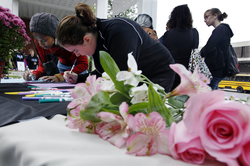 Students sign condolence cards for the family of Tyler Clementi on Friday at Rutgers University in New Brunswick, N.J. Clementi, 18, jumped off the George Washington Bridge after a secret video of his sexual encounter with a man was streamed online.