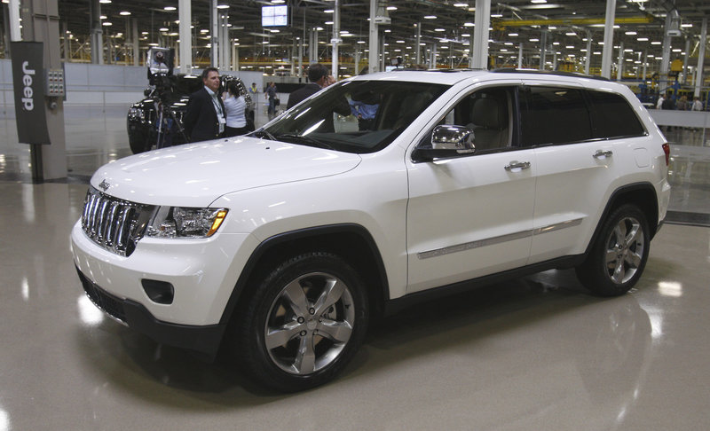 The 2011 Jeep Grand Cherokee, left, has been one of the bright spots in the auto industry, as low gas prices have helped to kindle consumer interest in crossovers, which are SUV bodies on car frames.