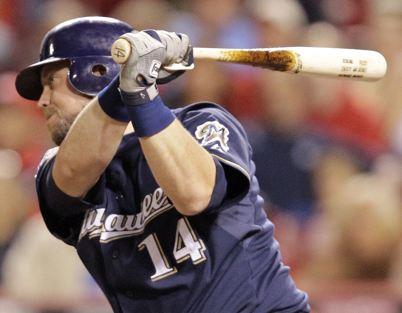 Casey McGehee singles to drive in Corey Hart with the winning run in the 11th inning Friday night, leading the Brewers to a 4-3 victory over the Reds at Cincinnati. Starter Mark Rogers went five innings for Milwaukee.