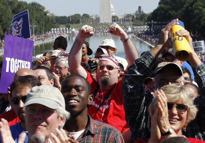 Activists gather at the Lincoln Memorial to participate in the "One Nation Working Together" rally to promote job creation, diversity and tolerance on Saturday.