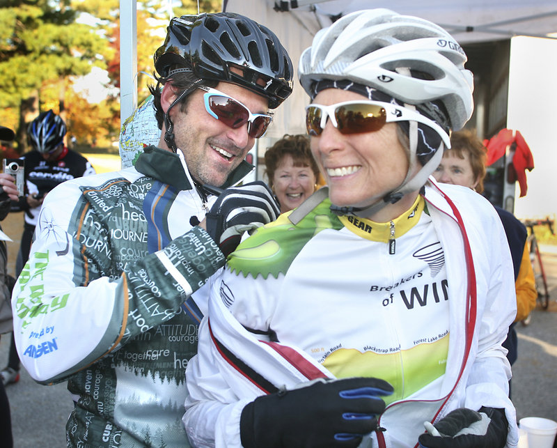 Actor Patrick Dempsey signs the jersey of participant Jody King of Buxton at the first rest stop for cyclists Sunday during the Dempsey Challenge, which raises funds for the Dempsey Center for Cancer Hope and Healing.