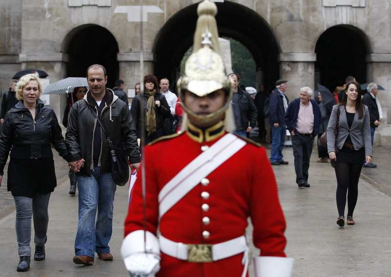 Tourists visit the Horse Guards Parade in London on Sunday. The U.S. government has warned its citizens in a new travel advisory to be vigilant while traveling in Europe because of the threat of an al-Qaida commando-style attack. The State Department advised nationals to take care while in tourist areas.