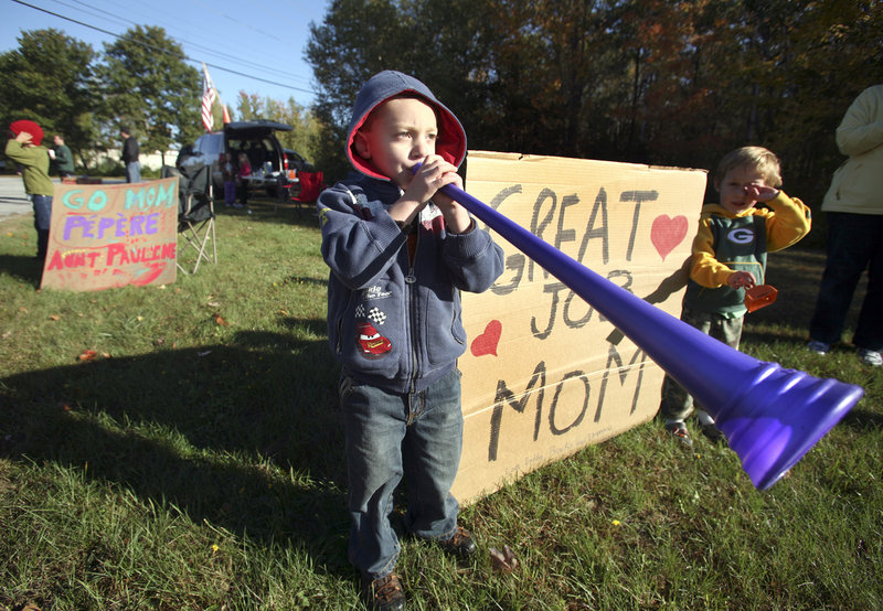 Ethan Boucher, 3, of Auburn blows a vuvuzela horn along the course to encourage the cyclists, including his father, Brian, during the Dempsey Challenge in Lewiston on Sunday.