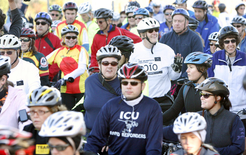 Cyclists line up before the start of the Dempsey Challenge on Sunday. The second annual event drew 4,172 participants in the walk, run and cycle events, and it topped last year s fundraising total of $1.1 million.