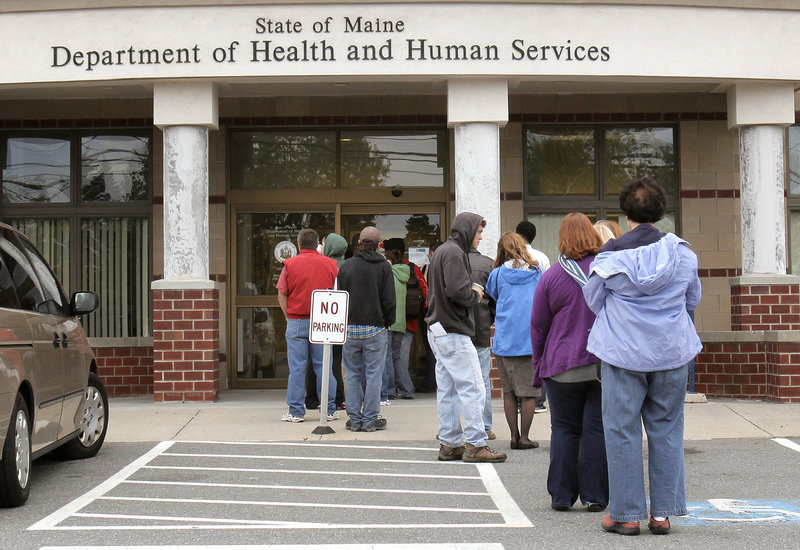 People wait outside the Department of Health and Human Services’ Portland office. The recession and the election have made aid to the poor an emotionally charged issue in the race for governor in Maine.