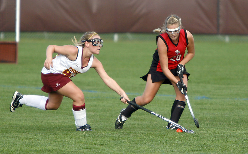 Breanna Thibodeau, left, of Thornton Academy attempts to steal the ball from South Portland’s Olivia Edwards.