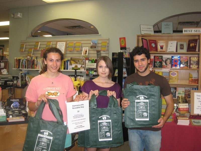 Chloe Maxmin, Sloane Fossett, Dana Malseptic, from left, pose with a sample bag for their proposed Damariscotta Reusable Bag program. Maxmin designed the bag and led a campaign to raise money and awareness for the reusable bag program that, to date, has kept some 700,000 plastic bags from ending up in the local landfill.