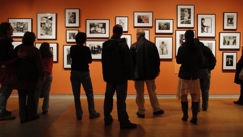 Visitors view a Portland Museum of Art exhibition in 2009. A survey solicited by the Maine Arts Commission has concluded that Maine’s museums attract hundreds of thousands of visitors who stay in hotels and B&Bs, spend money in local communities and travel widely across the state.