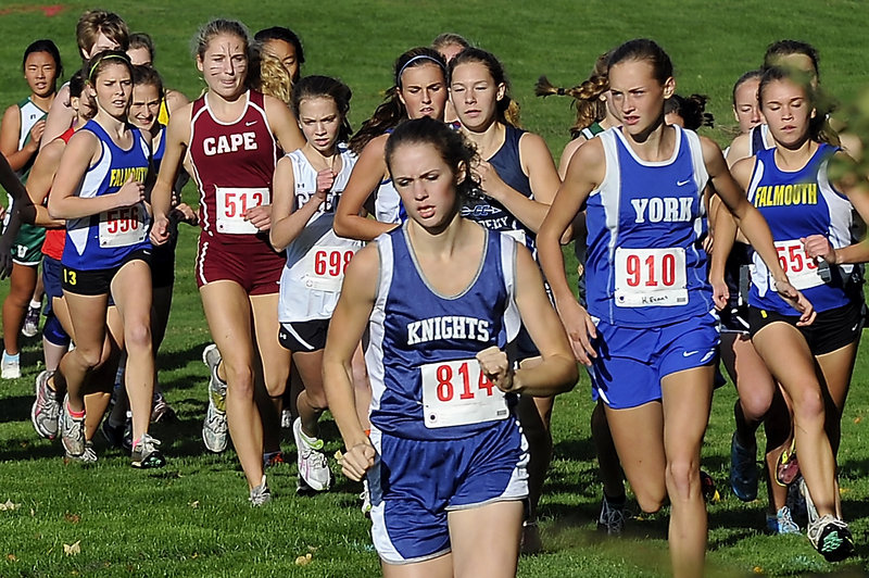 Kendra Lobley of Poland sets the early pace with eventual winner Heather Evans (910) of York close behind during the girls’ race at the Western Maine Conference cross country meet Thursday at Falmouth. Lobley finished fifth, and Cape Elizabeth won the Division I title.