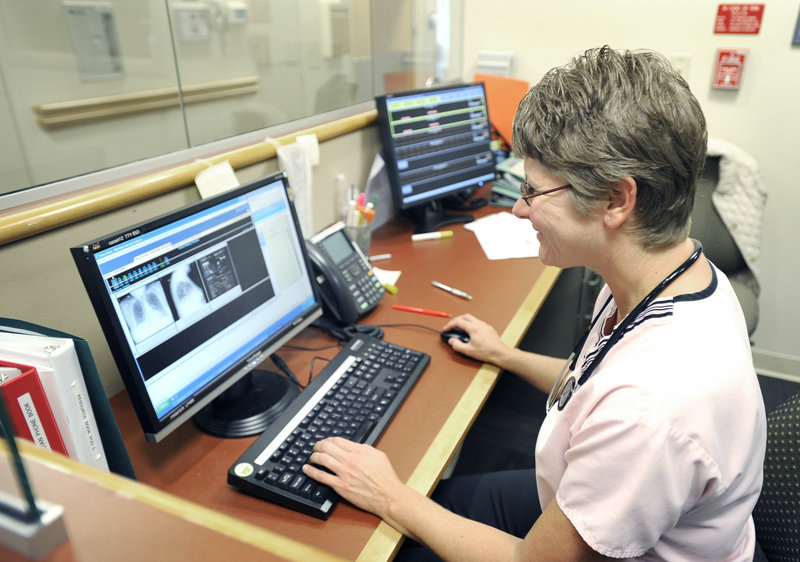 Marybeth Bubar, a nurse at Mid Coast Hospital in Brunswick, demonstrates the Internet speed the hospital gains from its connection to the first segment of the Three Ring Binder, a network that will link health care providers, campuses and other institutions across Maine.