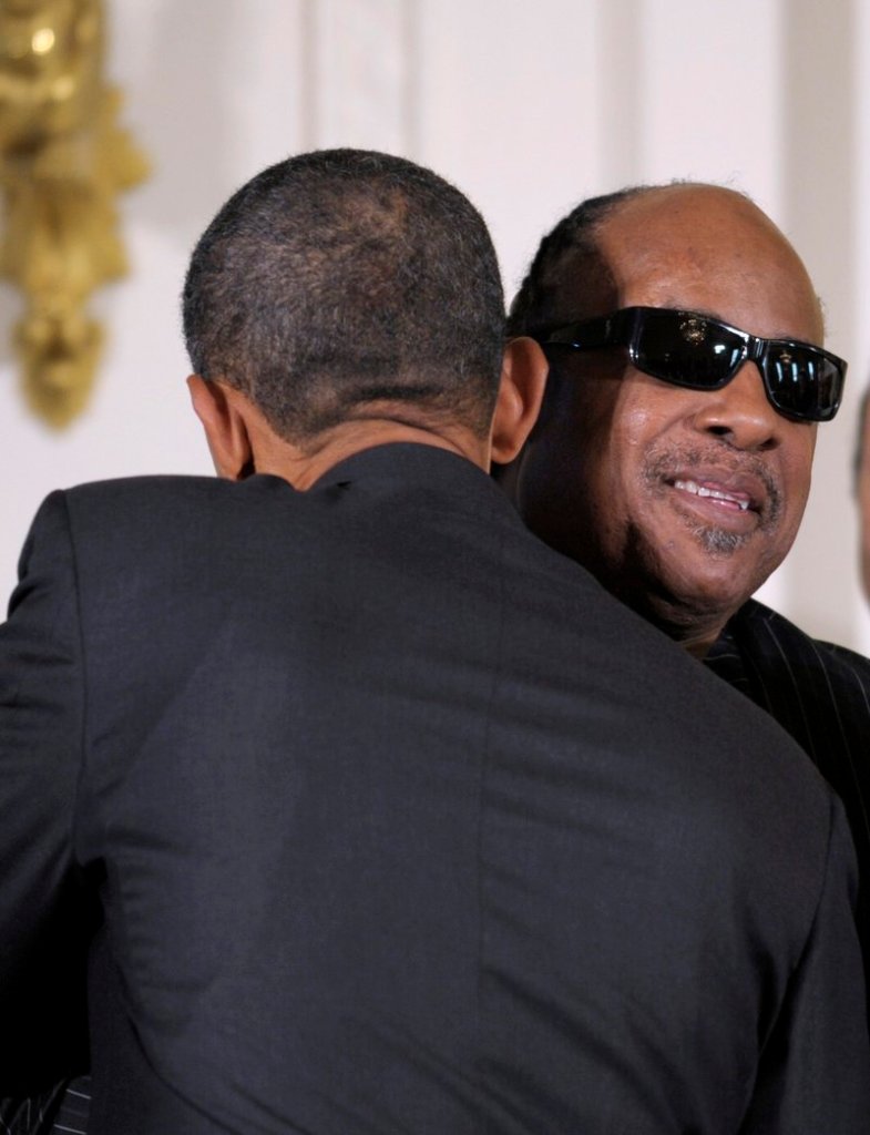 President Obama, left, hugs musician Stevie Wonder at the White House on Friday before signing the Twenty-First Century Communications and Video Accessibility Act.