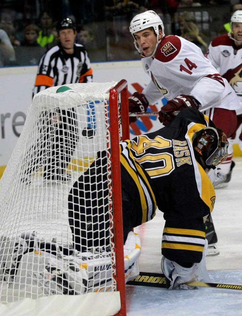 Taylor Pyatt of the Phoenix Coyotes watches his shot sail past Bruins goalie Tuukka Rask for a second-period goal in their season opener Saturday in the Czech Republic. The Coyotes won, 5-2.