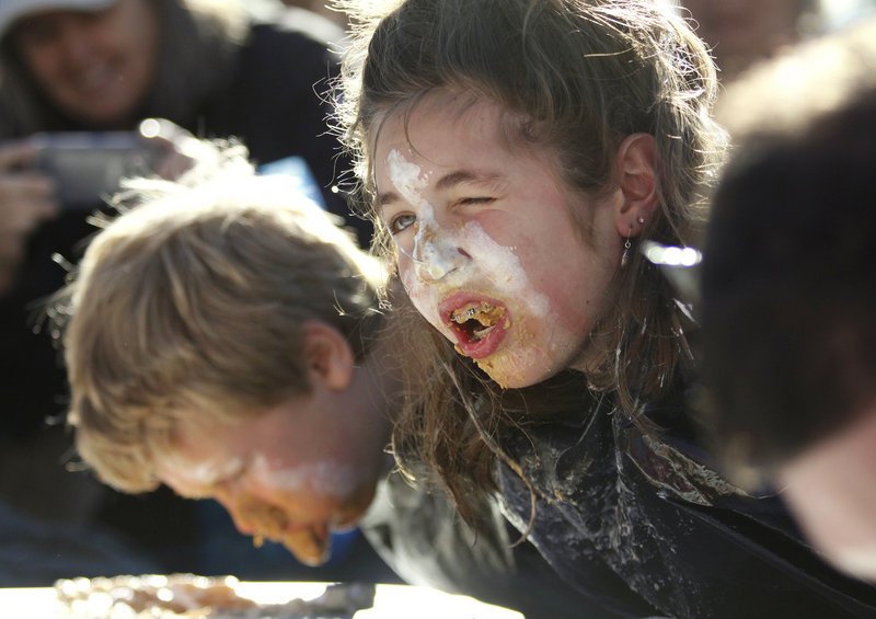 Brittany Marx, 13, of Fairfield takes a breather during the pumpkin pie eating contest on Saturday.