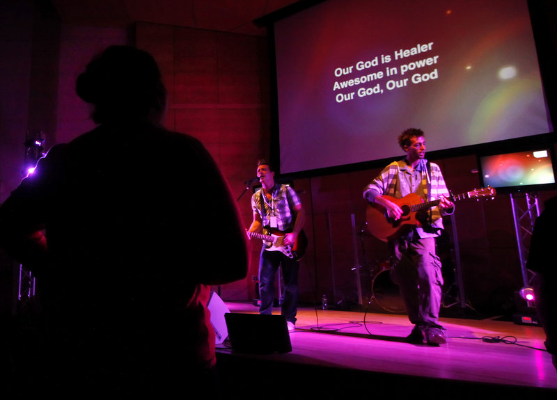 Devin Craig, left, and Jared Grant of the Next Level Church band perform Sunday.