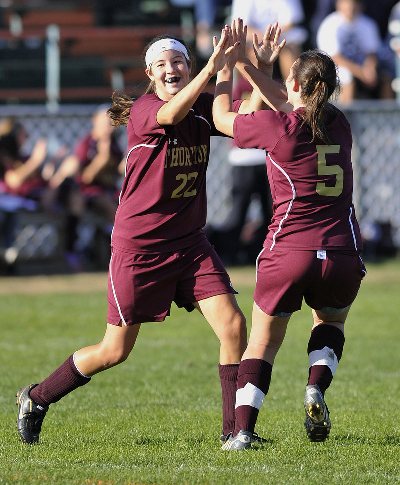 Lauren Titus, left, of Thornton Academy celebrates with Sarah Young after scoring a soccer goal Monday against Biddeford. Thornton won, 5-0.