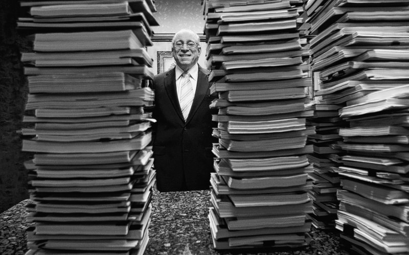 Florida lawyer Peter Ticktin, of The Ticktin Law Group, poses behind stacks of depositions from 150 robo-signers, people with no mortgage or document experience hired to sign foreclosure affidavits in many cases without reading them or knowing what they were signing.