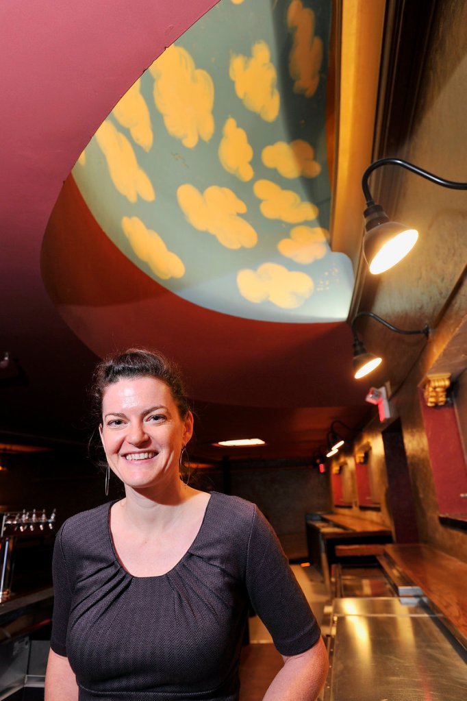 General manager Lauren Wayne stands in one of the venue’s renovated bar areas. The theater reopens Friday night with a concert by My Morning Jacket.