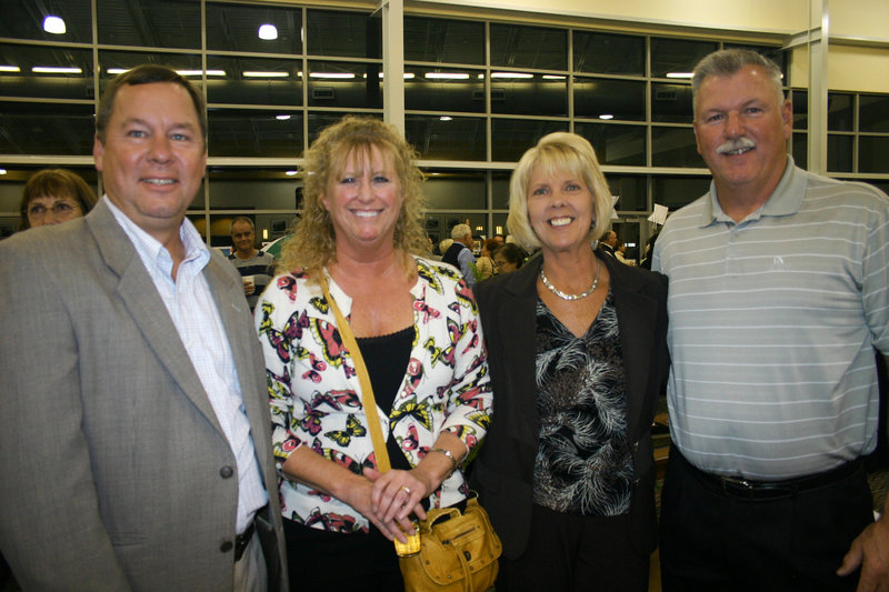 Jeff Ohman, who works for party sponsor Shaw's; Kathy Ohman; Noreen Savage, who also works for Shaw's and chaired the auction; and Mike Savage.