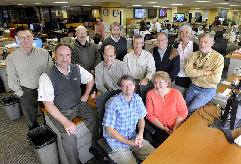 The Maine Press Association award winners from The Portland Press Herald/Maine Sunday Telegram include: seated from left, Gregory Rec and Sally Tyrrell; second row, Gordon Chibroski, David Hench, John Richardson, Mike Lowe, Julia McCue and John Ewing; and back row, Rick Wakely, Joe Grant and Bill Nemitz.
