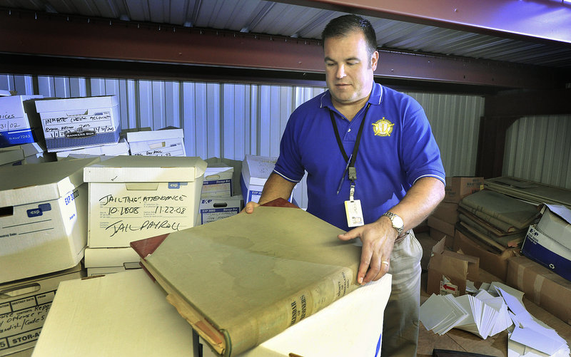John Ewing/Staff Photographer Capt. Dan Goulet of the Cumberland County Sheriff’s Department is overseeing a project to move old files and records into a more rodent-free rental storage unit.