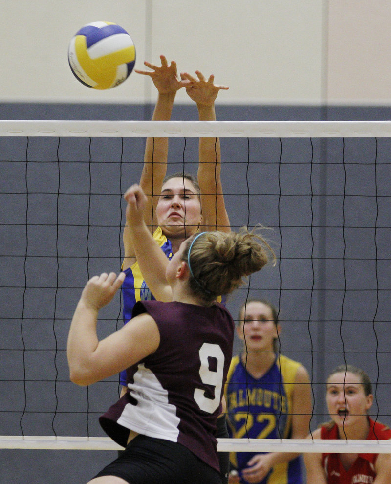 Nicole Rogers of Falmouth blocks a shot by Greely’s Danielle Cimino. Falmouth finished the regular season 12-2.