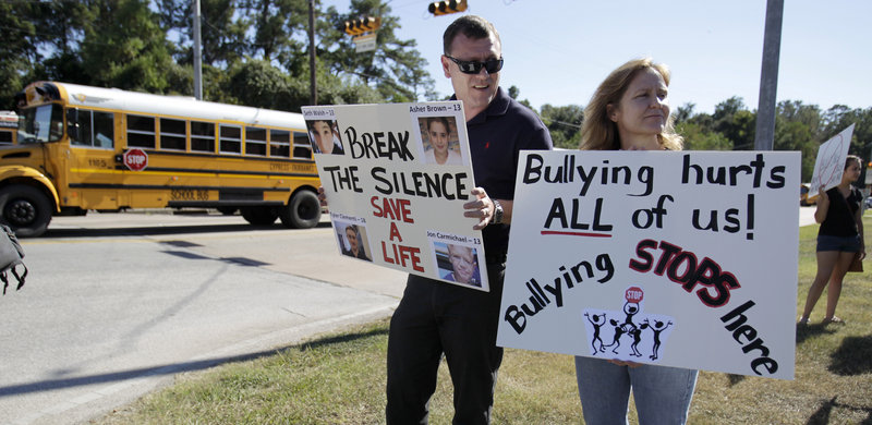 Near Hamilton Middle School in Cypress, Texas, demonstrators protest the treatment of student Asher Brown, who killed himself. Some wonder if anti-gay preaching gives homophobics ‘permission’ to bully.