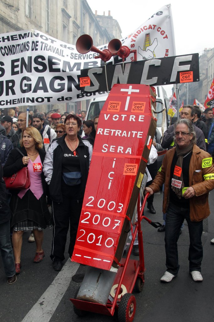 Demonstrator carry a coffin that reads, “Your retirement willbe here,” during a rally in Bordeaux, France, on Saturday. Ongoing protests target President Sarkozy’s pension reforms, including a proposal to raise the retirement age to 62.