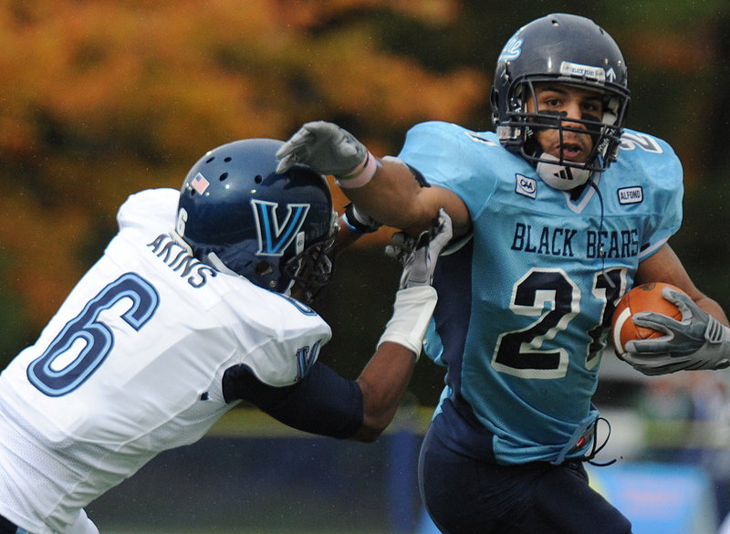 Maine running back Jared Turcotte tries to shrug off Villanova’s Ronnie Akins on Saturday, but Turcotte had just 35 yards rushing on seven carries as Maine lost, 48-18.