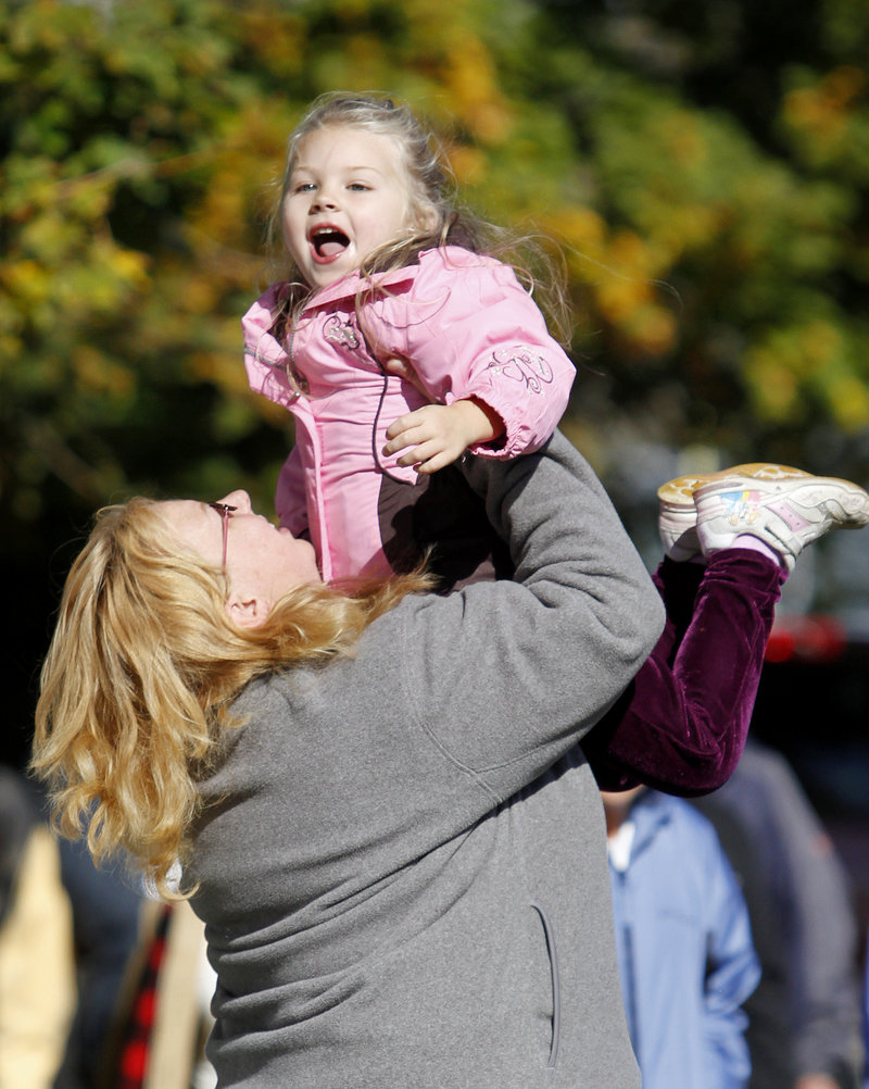 Holly DeCell of Sutton, Mass., dances to the Don Campbell Band, right, with her daughter Nicolette, 4.