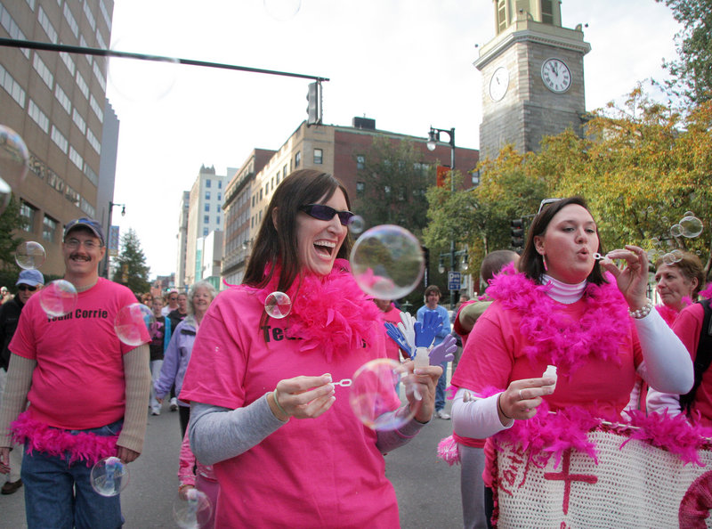 Organized by Charissa Kerr of Raymond, Team Corrie members walk in support of Corrie Painter of Oxford, Mass., who is battling angiosarcoma, during the Making Strides Against Breast Cancer Walk in Portland on Sunday.