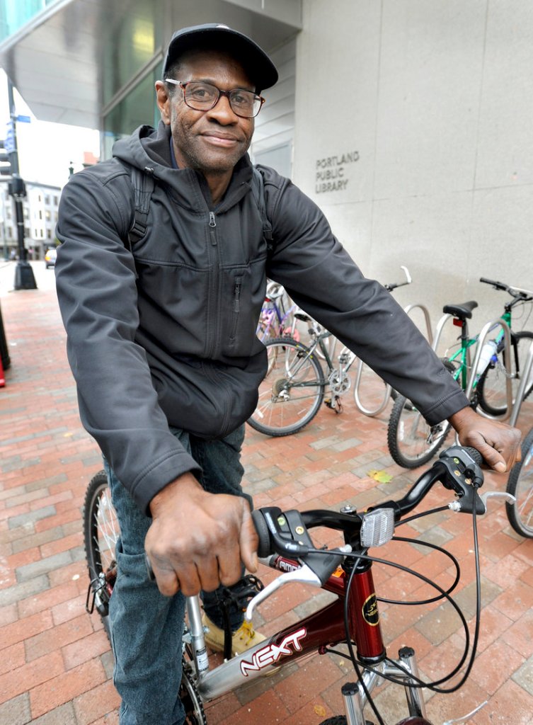 Dan Wright rides his bicycle every day from Portland to a job in Westbrook. He plans to get free of assistance soon.