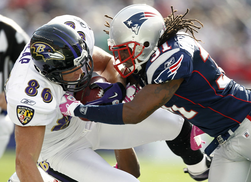 Todd Heap takes a shot from Patriots safety Brandon Meriweather in the first quarter. Heap left the game but returned. Meriweather was penalized for the hit.