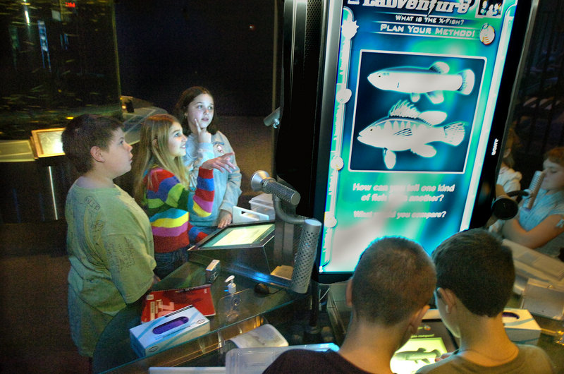 Students examine exhibits at the Gulf of Maine Research Institute.