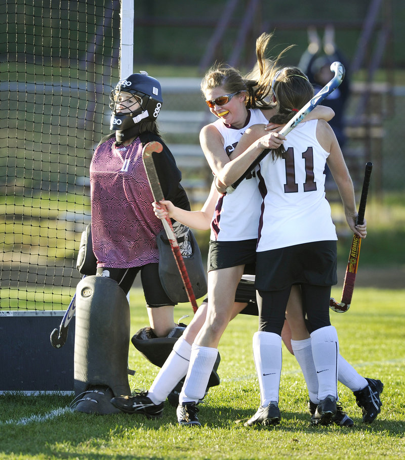 Eliza Porter of Greely hugs teammate Sarah Howard, 11, after scoring the goal that proved the difference Tuesday, giving the Rangers a 4-3 victory against Cape Elizabeth in a Western Class A quarterfinal.