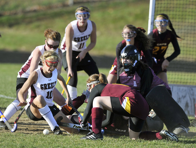 Jessica Wilson of Greely, 10, has her scoring bid knocked away by the Cape Elizabeth defense Tuesday as the ball pops loose. Third-ranked Greely advanced to the Western Class B semifinals with a 4-3 victory at home.
