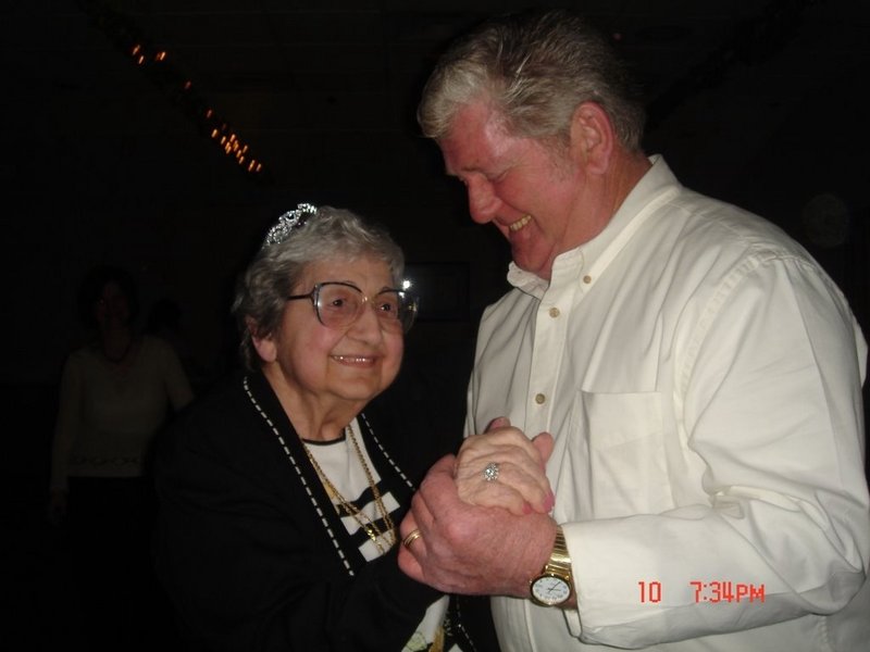 Sarah Brichetto dances at her 90th birthday party with her son Richard.