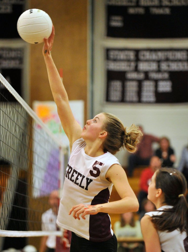 Elizabeth Bouchard of Greely hits a shot over the net Wednesday night during the four-game victory against Yarmouth. Greely will meet top-ranked Biddeford in the semifinals.