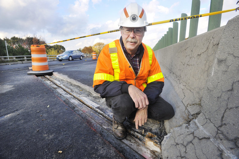 David Lycette of the Maine Department of Transportation shows the work being done on an I-295 overpass in Portland. Some projects will be extended to next summer as several bridges needed more repair than anticipated, but most roadwork will be finished by mid-November.